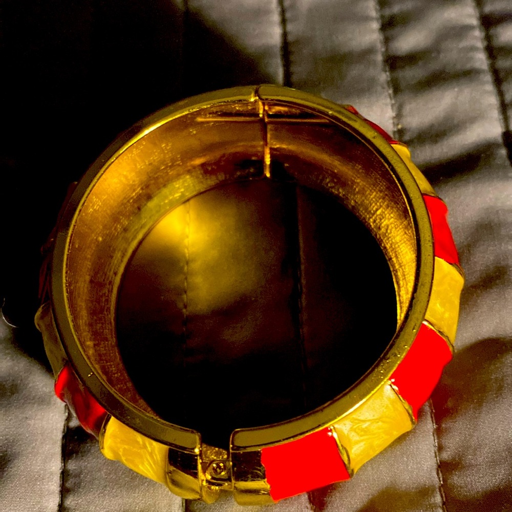 Beautiful brand new bracelet.  Enamel gold and cranberry
